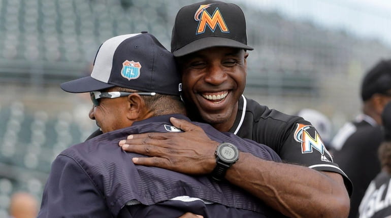Marlins hitting coach Barry Bonds, right, greets Yankees first base...