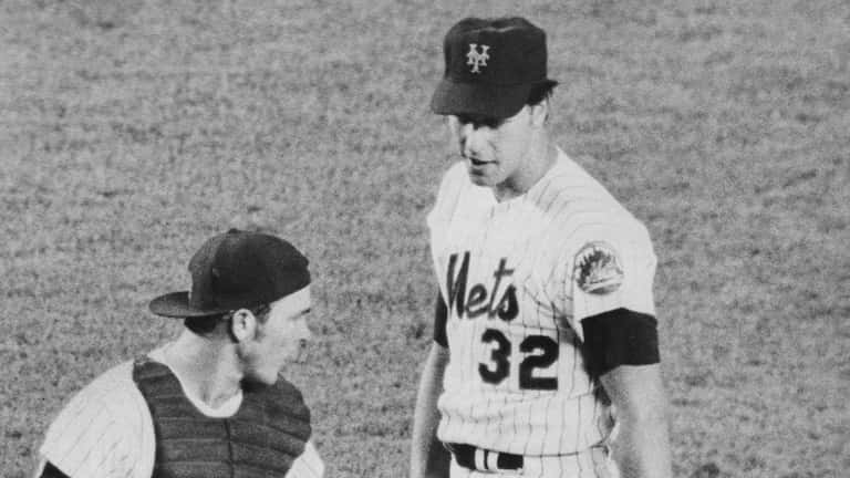 Lefty Jon Matlack, shown in a mound conference with Jerry...