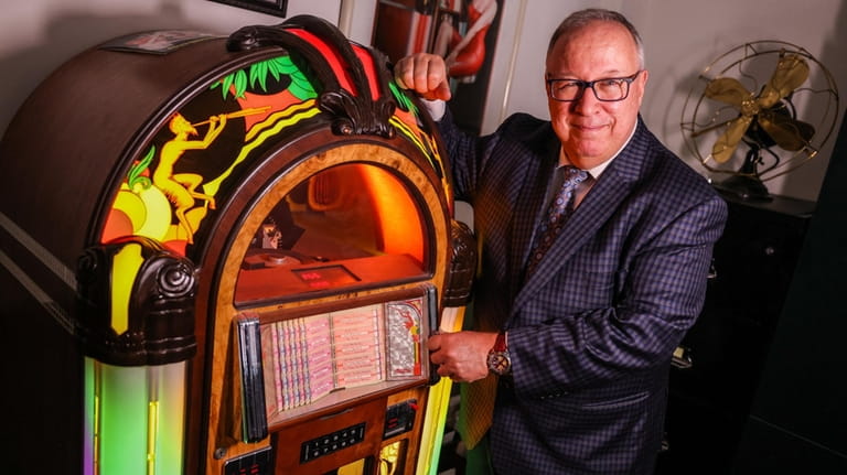 Anthony Ballato, of Massapequa, with his jukebox manufactured by Antique...