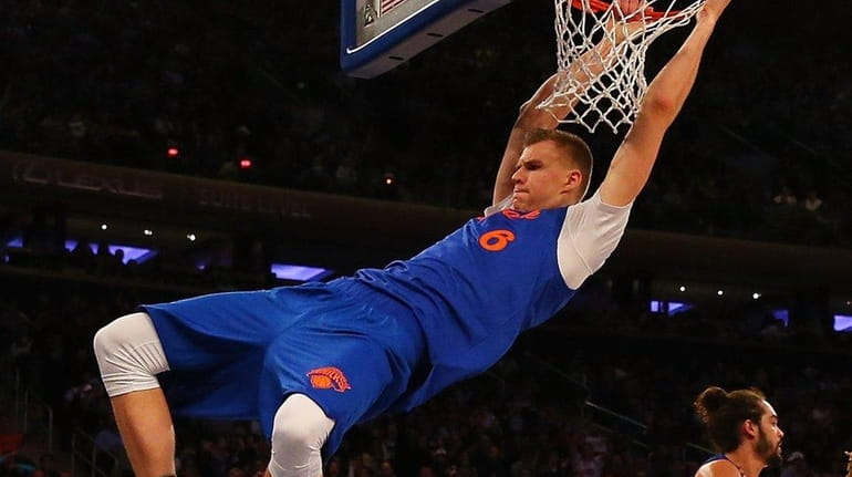 Kristaps Porzingis #6 of the New York Knicks dunks the...
