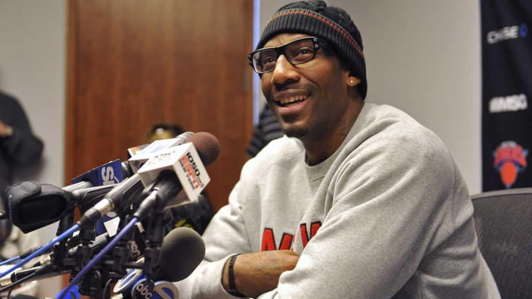 The Knicks' Amar'e Stoudemire smiles during a news conference at...