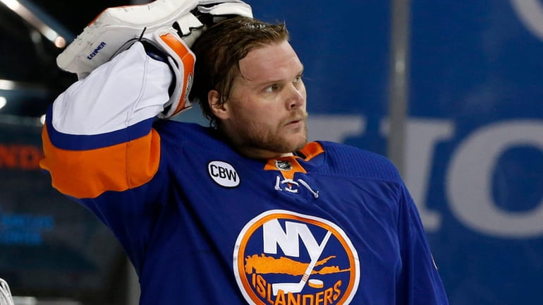 Robin Lehner looks on in the first period of Game...