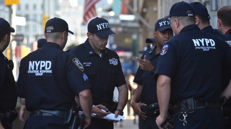 Members of the NYPD respond to a shooting at a...