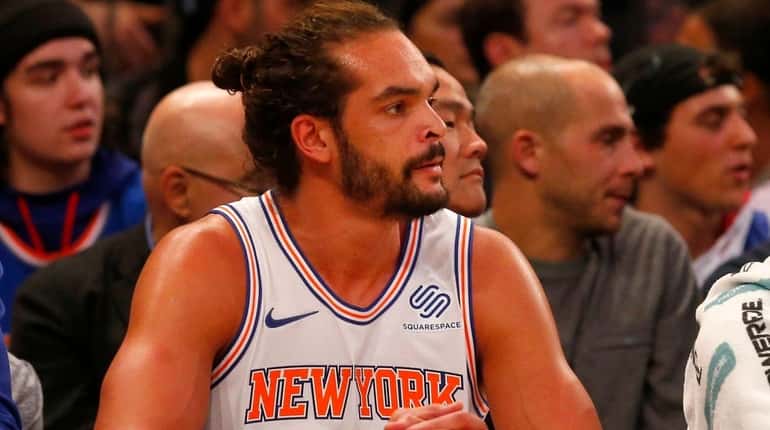 Joakim Noah watches from the Knicks' bench against the Trail...