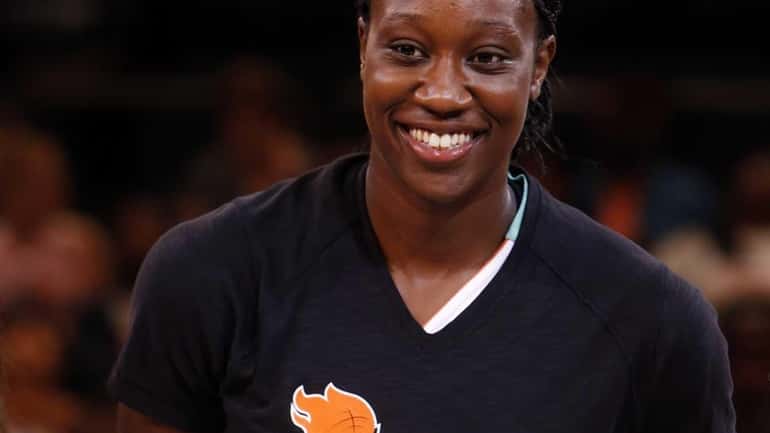 Liberty's Tina Charles accepts the NBA Cares State Farm Community...