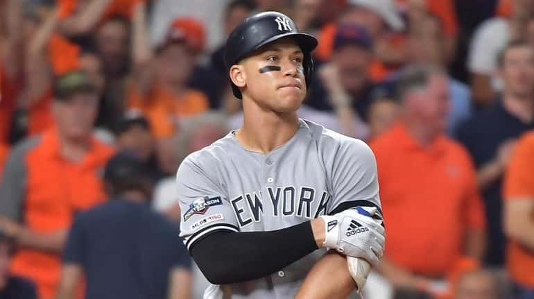 Yankees rightfielder Aaron Judge reacts after striking out to end the...