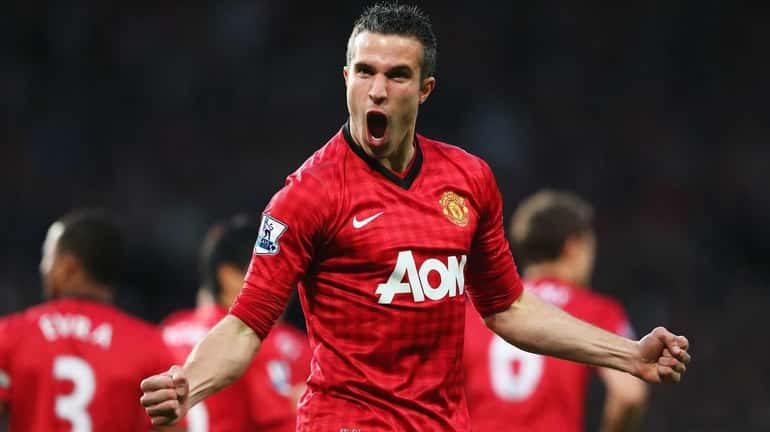 Robin van Persie of Manchester United celebrates after scoring the...