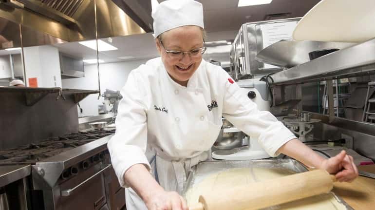 Christine Graf rolls out the sweet dough in the Baking...
