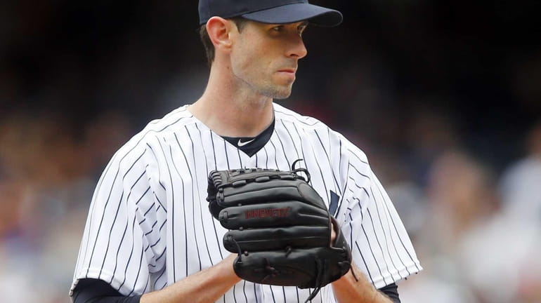 Brandon McCarthy of the Yankees pitches in the first inning...