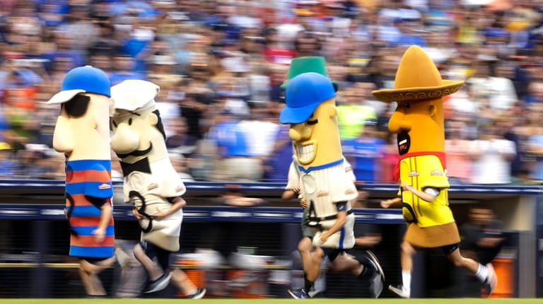 The Milwaukee Brewers' Famous Racing Sausages mascots during a game...