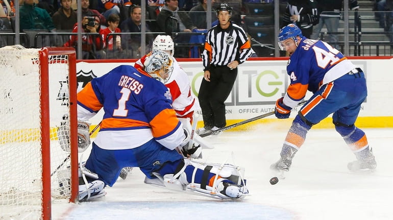 Thomas Greiss of the New York Islanders makes a save...
