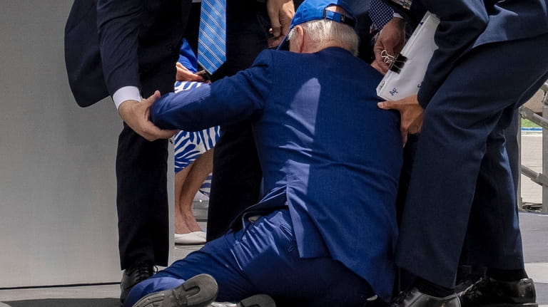 President Joe Biden falls on stage during the 2023 United...