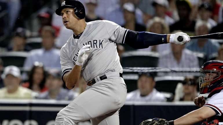 Alex Rodriguez watches his grand slam in the eighth inning...