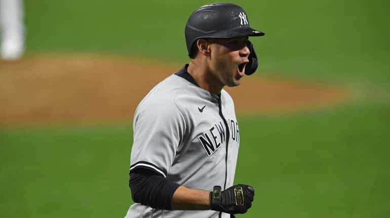 The Yankees' Gary Sanchez reacts after hitting a two-run home...