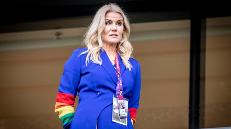 Former Danish Prime Minister Helle Thorning-Schmidt wears a rainbow-colored armband...