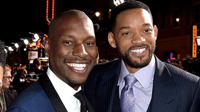Actors Tyrese Gibson, left, and Will Smith in 2015.