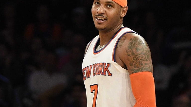 Knicks forward Carmelo Anthony reacts after he misses a shot...