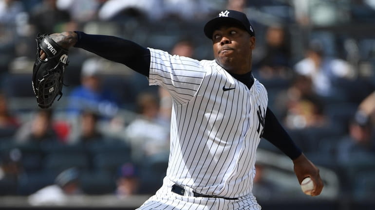 New York Yankees relief pitcher Aroldis Chapman delivers against the...