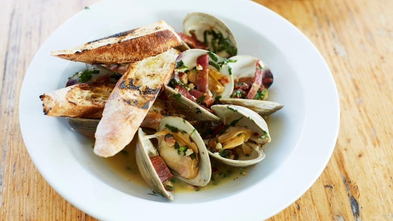 Steamed littleneck clams with chorizo, lemon and parsley at Five...