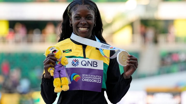 Gold medalist Shericka Jackson, of Jamaica, poses during a medal...