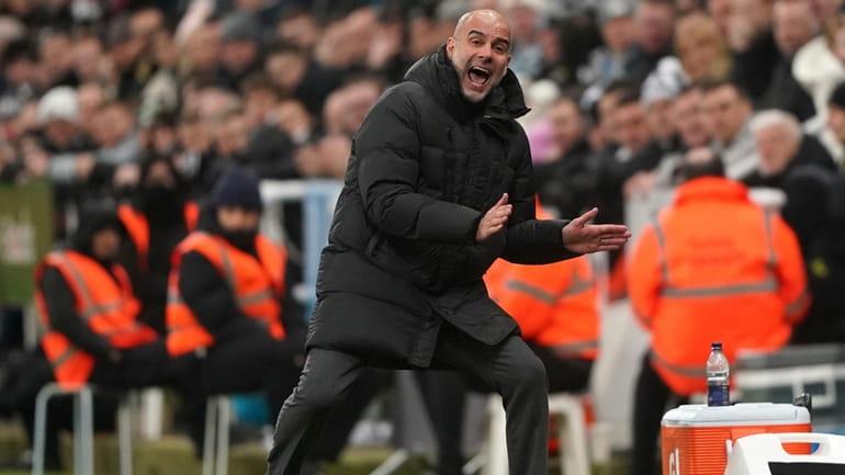 Manchester City manager Pep Guardiola gestures on the touchline, during...