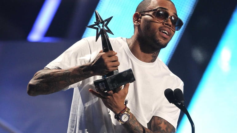 Chris Brown accepts the award for best male R&B at...