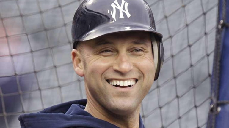 New York Yankees shortstop Derek Jeter smiles during a conversation...