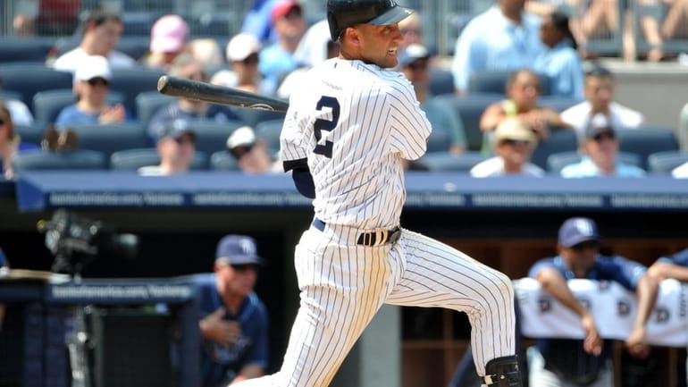 Yankees shortstop Derek Jeter hits an RBI single that gives...