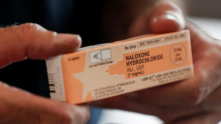 Naloxone, a lifesaving medication that reverses opioid overdoses, is carried at...