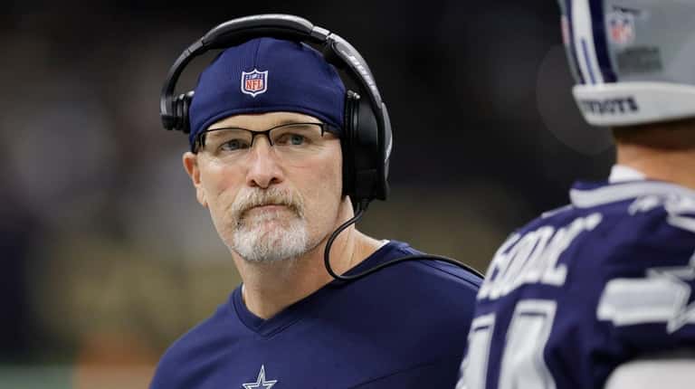 Cowboys acting head coach Dan Quinn walks the sidelines during...