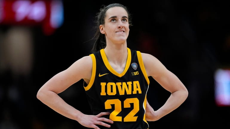Iowa guard Caitlin Clark stands on the court during the...
