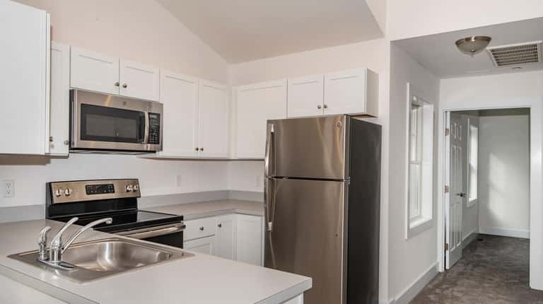 The kitchen of a one-bedroom condominium unit, which is priced...
