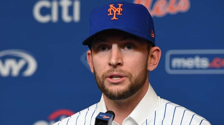 The Mets' Jed Lowrie speaks during his introductory press conference...