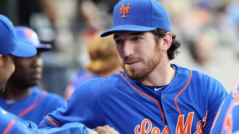 Ike Davis of the New York Mets looks on from...