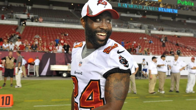 Cornerback Darrelle Revis of the Tampa Bay Buccaneers leaves the...