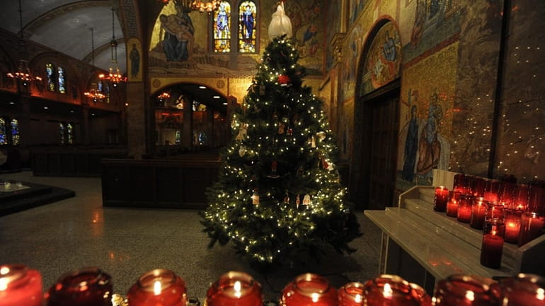 Christmas trees decorate the interior of Greek Orthodox Cathedral of...