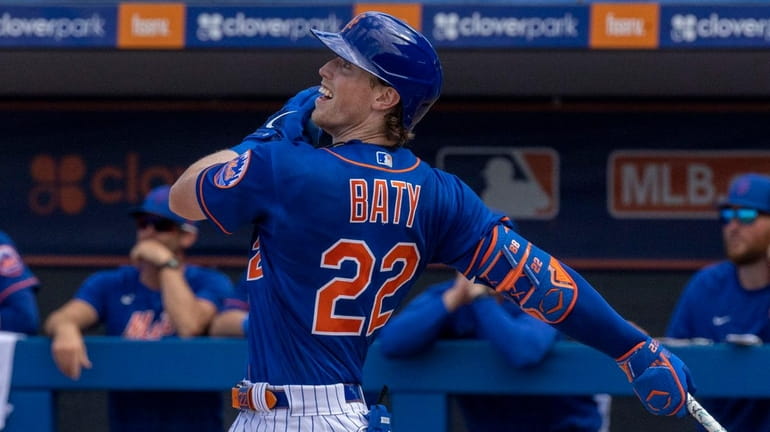 Mets infielder Brett Baty hits a double during a spring...