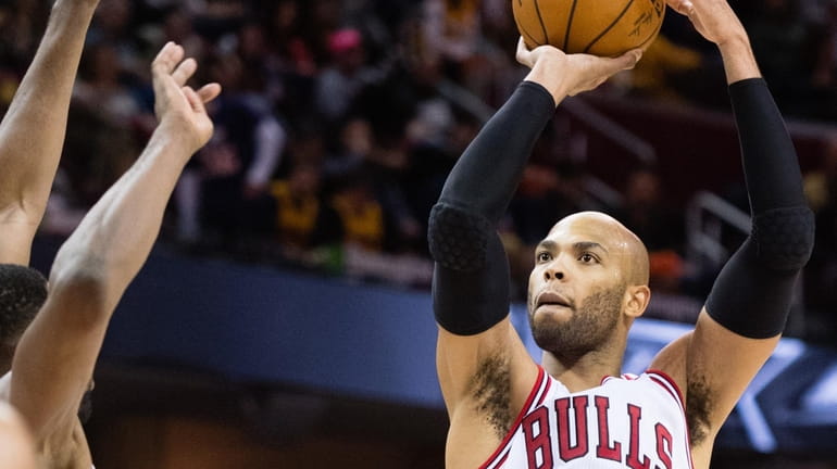 Taj Gibson #22 of the Chicago Bulls shoots during the...