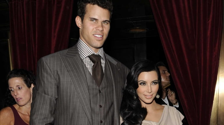 Kim Kardashian and Kris Humphries during happier times in August...