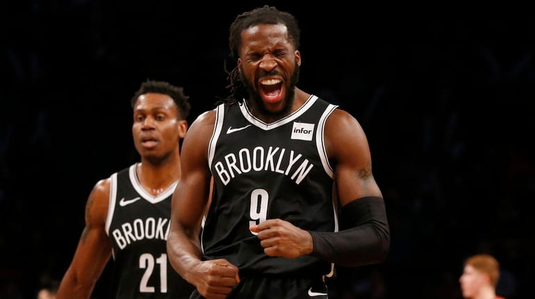 DeMarre Carroll #9 of the Brooklyn Nets reacts after hitting...