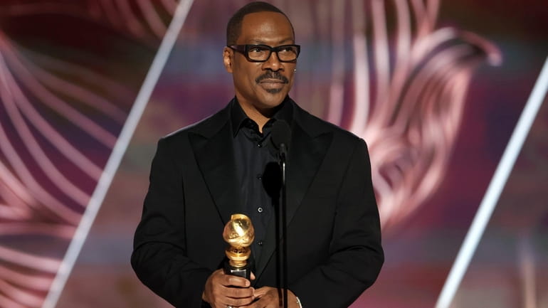 Roosevelt-raised Eddie Murphy accepts the Cecil B. DeMille Award onstage during...