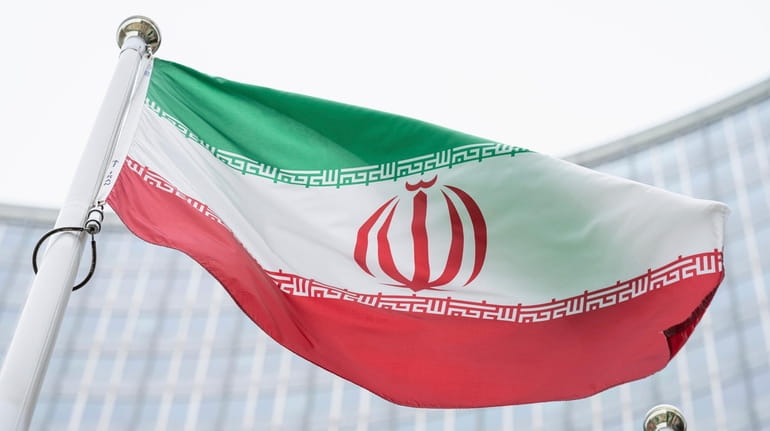 The flag of Iran waves in front of the International...