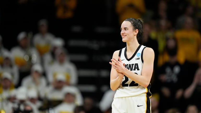 Iowa guard Caitlin Clark reacts in the second half of...
