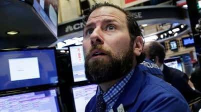 Michael Pistillo Jr. follows stock prices at the New York...