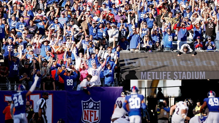 New York Giants fans celebrate during the second half against...