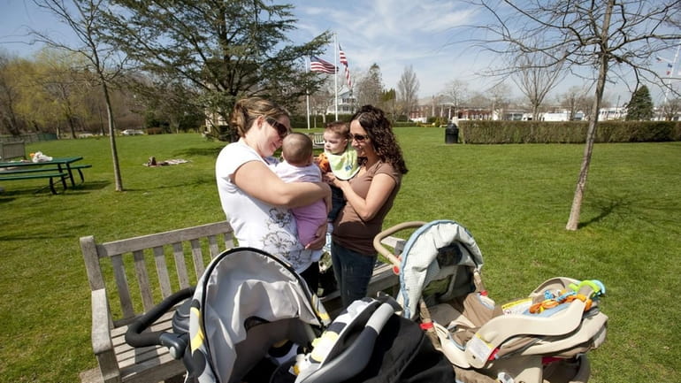 Kim Garypie, left, with daughter Layla, from Sag Harbor, and...