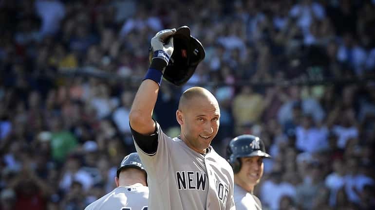 The Yankees' Derek Jeter gets taken out of the game...