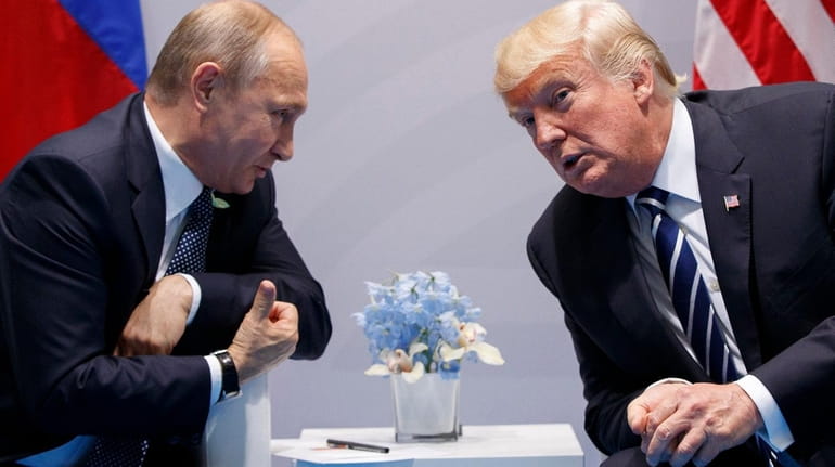 President Donald Trump meets with Russian President Vladimir Putin at...