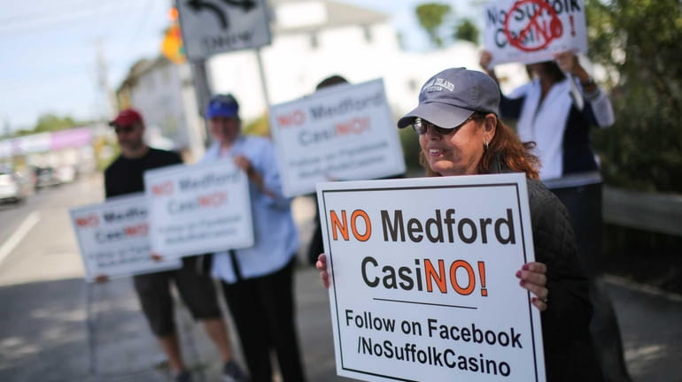 Loretta Nastasi of Medford holds a "No Medford CasiNO!" sign...