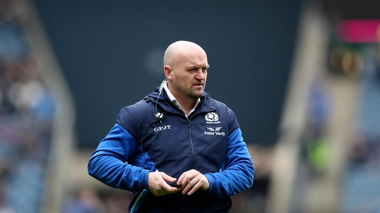 Scotland's head coach Gregor Townsend watches on as players warm...
